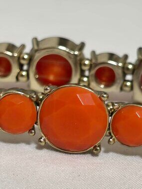 Cara NY; gold and orange stretchy bracelet